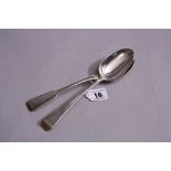 TWO SILVER RAT TAIL SERVING SPOONS, having monogrammed terminals, London 1827 and Exeter 1816?,