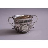 A SILVER PORRINGER, having half fluted body, circular cartouche monogrammed A & L and 1922-1917,