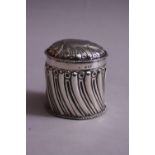 A LIDDED SILVER CYLINDRICAL POT, having reeded decoration, monogrammed to removable lid, London