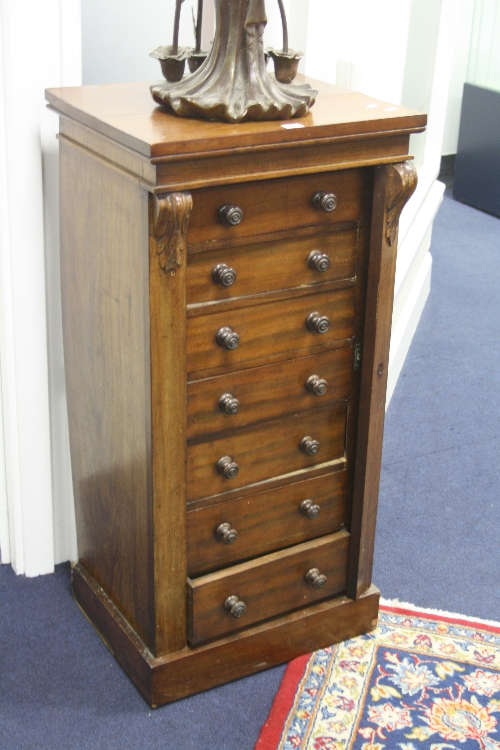 A VICTORIAN MAHOGANY WELLINGTON CHEST, with seven graduating drawers on plinth base, approximate