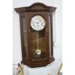 A MODERN MAHOGANY CASED WALL CLOCK, marked Wm Widdop (pendulum)