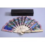 AN EARLY 20TH CENTURY CANTONESE FAN, having sixteen carved and pierced ivory blades with figures,