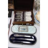 A LATE VICTORIAN WALNUT CASED SET OF TWELVE MOTHER OF PEARL HANDLED DESSERT KNIVES AND FORKS,