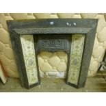 A CAST IRON FIRE PLACE INSERT, approximate size width 97cm x height 96cm