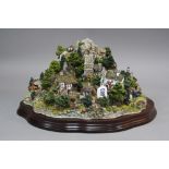 A LIMITED EDITION LILLIPUT LANE SCULPTURE, modelled as 'Coniston Crag', L2169, 119/3000, with stand