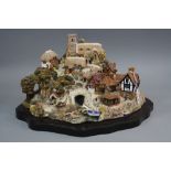 A LILLIPUT LANE SCULPTURE, modelled as 'St Peter's Cove', Limited Edition of 3000, with stand