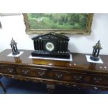 A BLACK MARBLE ARCHITECTURAL MANTEL CLOCK GARNITURE, having circular enamelled dial with Arabic