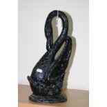A COALBROOKDALE DOORSTOP, in the form of a Swan, painted black, cast mark to base, height