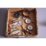 A BOX OF MISCELLANEOUS, to include three compasses, two thimbles, novelty silver bookmark moulded as