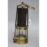 A BRASS AND GAUZE DAVY MINERS LAMP, having brass domed top impressed CLN 206 over tapering central