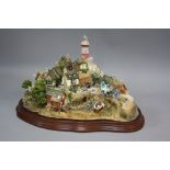 A LIMITED EDITION LILLIPUT LANE SCULPTURE, modelled as 'Out of the Storm', L2064, 2459/3000, with