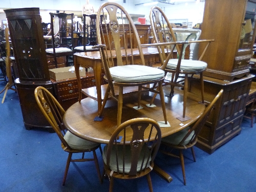 AN 'ERCOL' DINING SUITE, comprising oval table, approximate size length 165cm x width 123cm x height