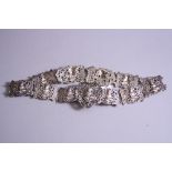 AN EDWARDIAN SILVER NURSE'S BELT, cast with Eastern deities, maker B & W, Birmingham 1902, with