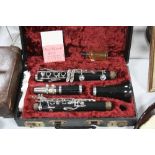 A CASED CAMBRIDGE PLASTIC AND PLATED CLARINET