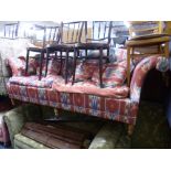 AN UPHOLSTERED THREE SEATER SETTEE