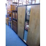 A FIVE PIECE STAG TEAK BEDROOM SUITE, comprising a wardrobe, dressing table with mirror, chest of