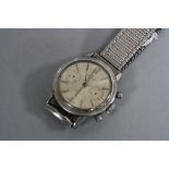 A STAINLESS STEEL BREITLING 'TOP TIME' WRISTWATCH, missing secondary hands (not working)