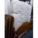 A 5' DIVAN BED, and mattress with drawers and a pine headboard