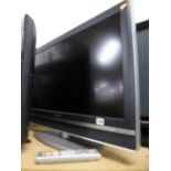 A SONY 32' LCD TV, and a glass three tier TV stand (remote) (2)