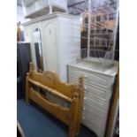 A MODERN CREAM TWO PIECE BEDROOM SUITE, comprising of a three door wardrobe and a chest of five long