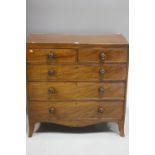 A MAHOGANY CHEST OF DRAWERS, having two short over three long drawers, all with turned handles on