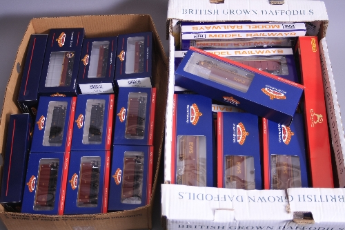 A QUANTITY OF BOXED ASSORTED OO GAUGE EWS LIVERIED WAGONS, Hornby, Bachmann and Dapol (2 boxes)