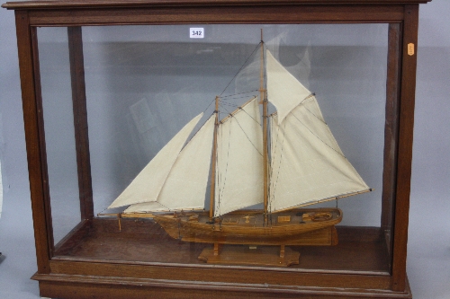 A 20TH CENTURY WOODEN SCRATCH BUILT MODEL OF THE 19TH CENTURY RACING YACHT, 'AMERICA', modelled at