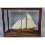A 20TH CENTURY WOODEN SCRATCH BUILT MODEL OF THE 19TH CENTURY RACING YACHT, 'AMERICA', modelled at