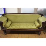 A VICTORIAN MAHOGANY FRAMED SOFA, leaf moulded detail to the back above scrolled arms with moulded