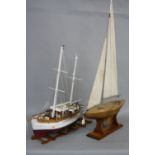 A WOODEN SCRATCH BUILT MODEL OF A FISHING VESSEL, painted white and red on a wooden stand, height