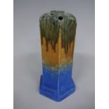 A RUSKIN POTTERY HEXAGONAL SPILL VASE, having green, orange and blue crystalline glaze, stepped base