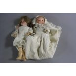 AN ARMAND MARSEILLE BISQUE HEAD BABY DOLL, nape of neck marked 'AM Germany 311/2K', eyes loose in