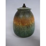 A RUSKIN POTTERY LAMP BASE, of ovoid form having green and orange crystalline glaze, impressed