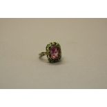 A SYNTHETIC PINK SAPPHIRE AND ENAMEL DRESS RING, in white metal, ring size estimated J (ring clip