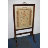 A MAHOGANY FRAMED FREE STANDING FIRESCREEN, with the screen being formed with a Battle honours