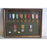 A GLAZED FRAME CONTAINING A NUMBER OF WWII MEDALS, as follows...1939-45, Atlantic, Air Crew