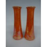 A PAIR OF RUSKIN POTTERY TRUMPET VASES, in orange lustre glaze, both impressed Ruskin, England