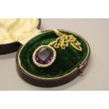 A LATE VICTORIAN OVAL AMETHYST AND SEED PEARL PENDANT, amethyst measuring approximately 23mm x