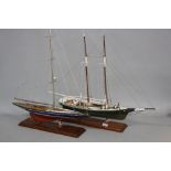 TWO 20TH CENTURY SCRATCH BUILT WOODEN MODEL BOATS, one with single mast, on a plinth, height