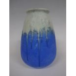 A RUSKIN POTTERY BARREL VASE, having relief floral and leafage decoration to upper body, blue