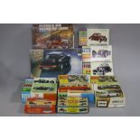 A QUANTITY OF BOXED UNBUILT VINTAGE PLASTIC CAR CONSTRUCTION KITS, to include Airfix, Pyro,