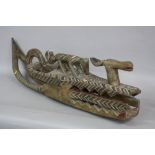 TRIBAL ART, a wooden West African forehead mask, carved with joined horns, linked hoops, animals and