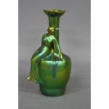 A ZSOLNAY PECS GREEN LUSTRE VASE, having globular body on long neck with wavy rim, with seated Art