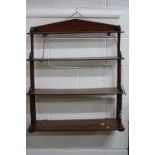 A SET OF 19TH CENTURY MAHOGANY FOUR TIER WALL SHELVES, with spindle supports and turned finials,