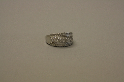 A MODERN WHITE GOLD AND DIAMOND WIDE BAND DRESS RING, total diamond weight approximately 0.60ct,