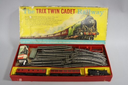 A BOXED TRIX TWIN CADET PASSENGER RAILWAY SET, comprising damaged unnumbered 0-4-0T locomotive in