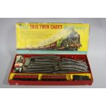 A BOXED TRIX TWIN CADET PASSENGER RAILWAY SET, comprising damaged unnumbered 0-4-0T locomotive in