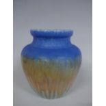 A RUSKIN POTTERY OVOID SHOULDERED VASE, having blue, green and dripping orange crystalline glaze,