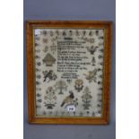 A VICTORIAN SAMPLER, geometric border surrounding a three verse religious text titled 'Humility',