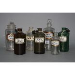 SEVEN VICTORIAN/EDWARDIAN PHARMACY BOTTLES, with painted or paper labels, six with glass stoppers,